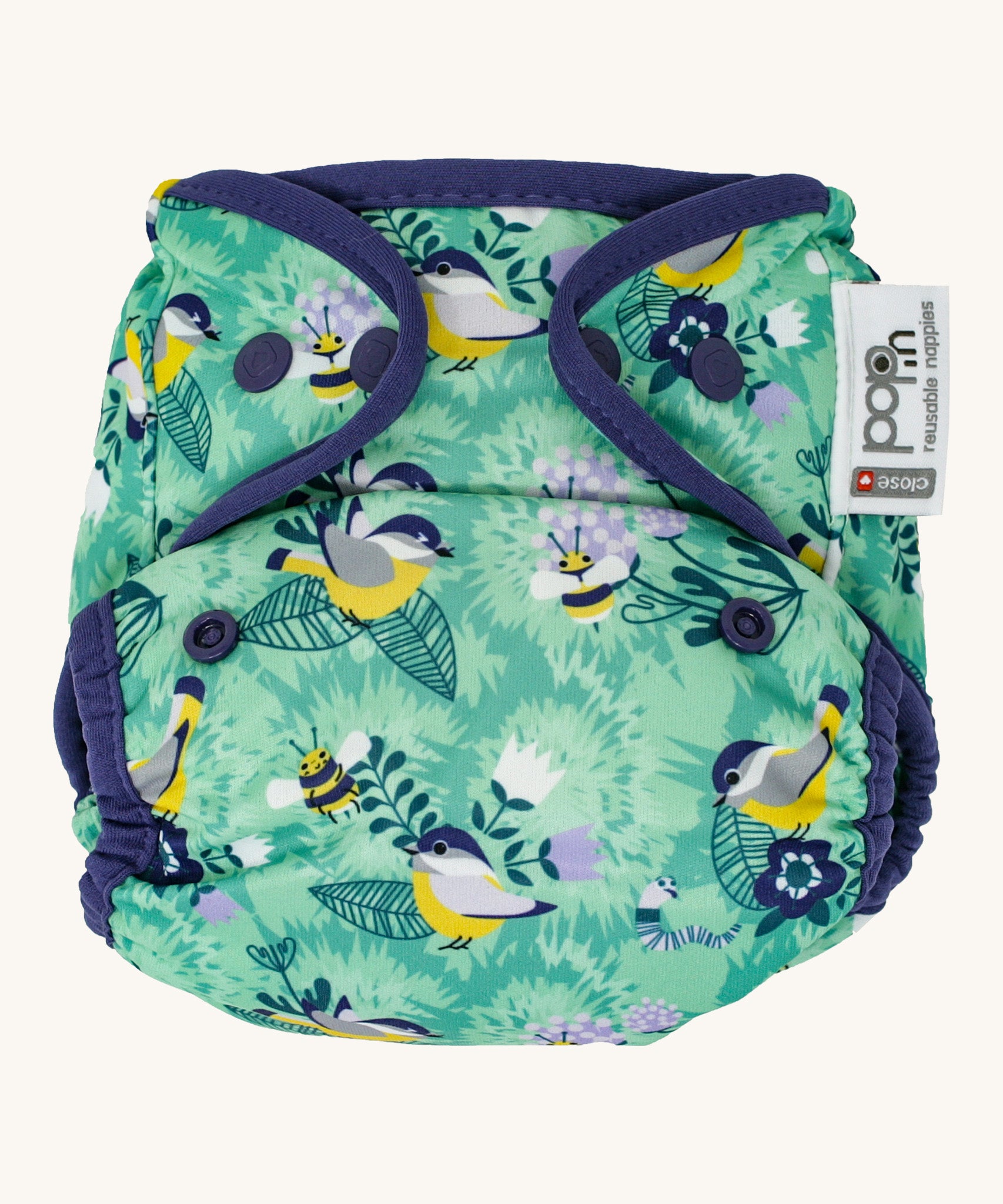 The Close Pop-In +bamboo reusable cloth nappy with adjustable popper closures, in a round the garden print