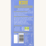 The back of the Divine White Chocolate Lemon Cheesecake Dessert Bar in it's wrapping showing the ingredients list.