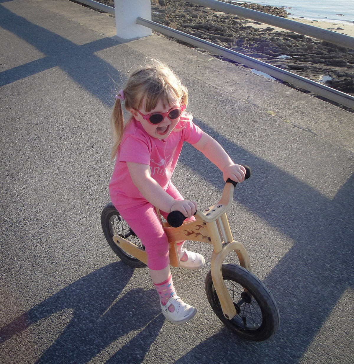 little girl riding an Early Rider Lite Balance Bike