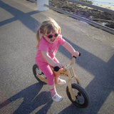 little girl riding an Early Rider Lite Balance Bike