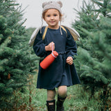 enjoying a drink from their One Green Bottle 350ml Evolution Collection Bottle - Sports Cap in Ocean