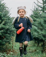 enjoying a drink from their One Green Bottle 350ml Evolution Collection Bottle - Sports Cap in Ocean