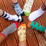 A group photo of kids wearing the different animal themed Eco Kiddies organic cotton socks