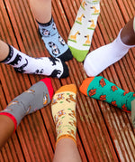 A group photo of kids wearing the different animal themed Eco Kiddies organic cotton socks