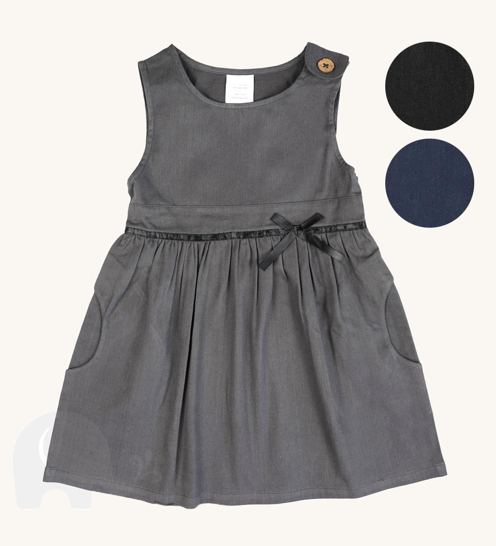 The Eco Outfitters organic and fair trade cotton school pinafore dress in grey with a bow detail, along with other colour swatches.