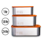 Three different sizes of the Elephant Box Prep & Store food storage containers, with orange silicone and glass lids.