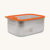 The Elephant Box Prep & Store medium food storage container with an orange silicone seal and see through glass lid.