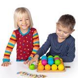 Erzi wooden multicoloured balls stacking game on a wooden base played with children
