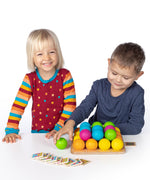 Erzi wooden multicoloured balls stacking game on a wooden base played with children