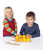 Erzi wooden multicoloured balls stacking game on a wooden base played with