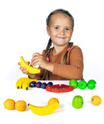Erzi wooden threading fruits educational game played with a child