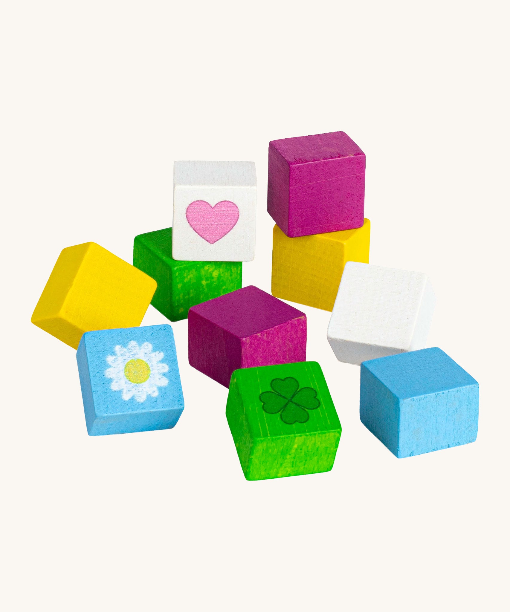 Erzi opened wooden chocolate cubes on a cream background.