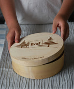 Erzi wooden painted forest toy mushrooms in a round wooden box. A child can be seen lifting the lid off the box.