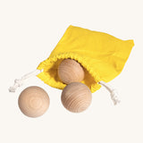 Erzi wooden outdoor marble set of 3 in a yellow pouch on a cream background.