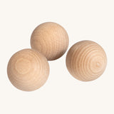 Erzi wooden outdoor marble set of 3 on a cream background.