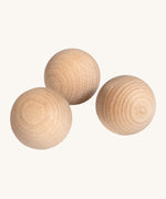 Erzi wooden outdoor marble set of 3 on a cream background.