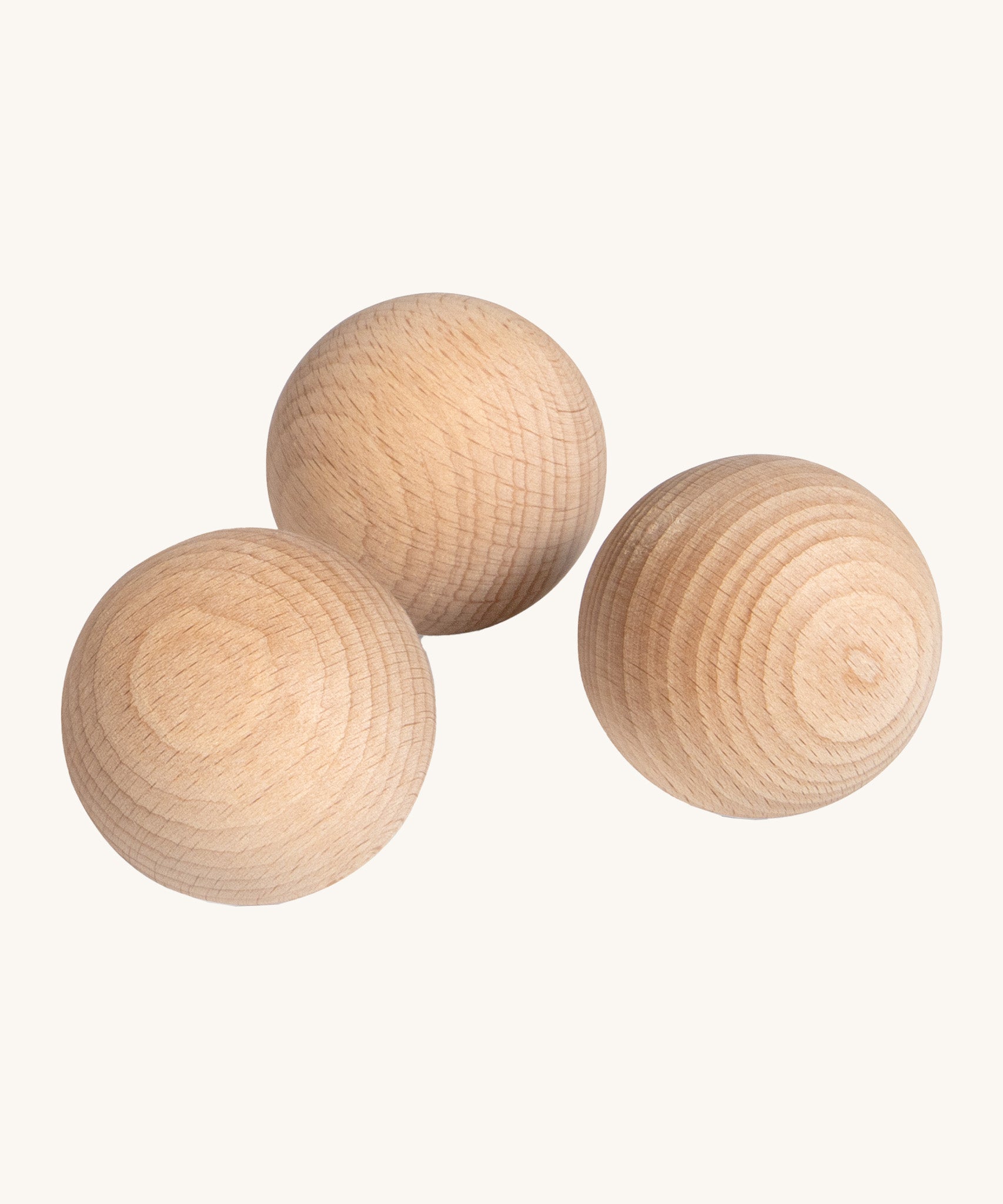 Erzi wooden outdoor marble set of 3 on a cream background.