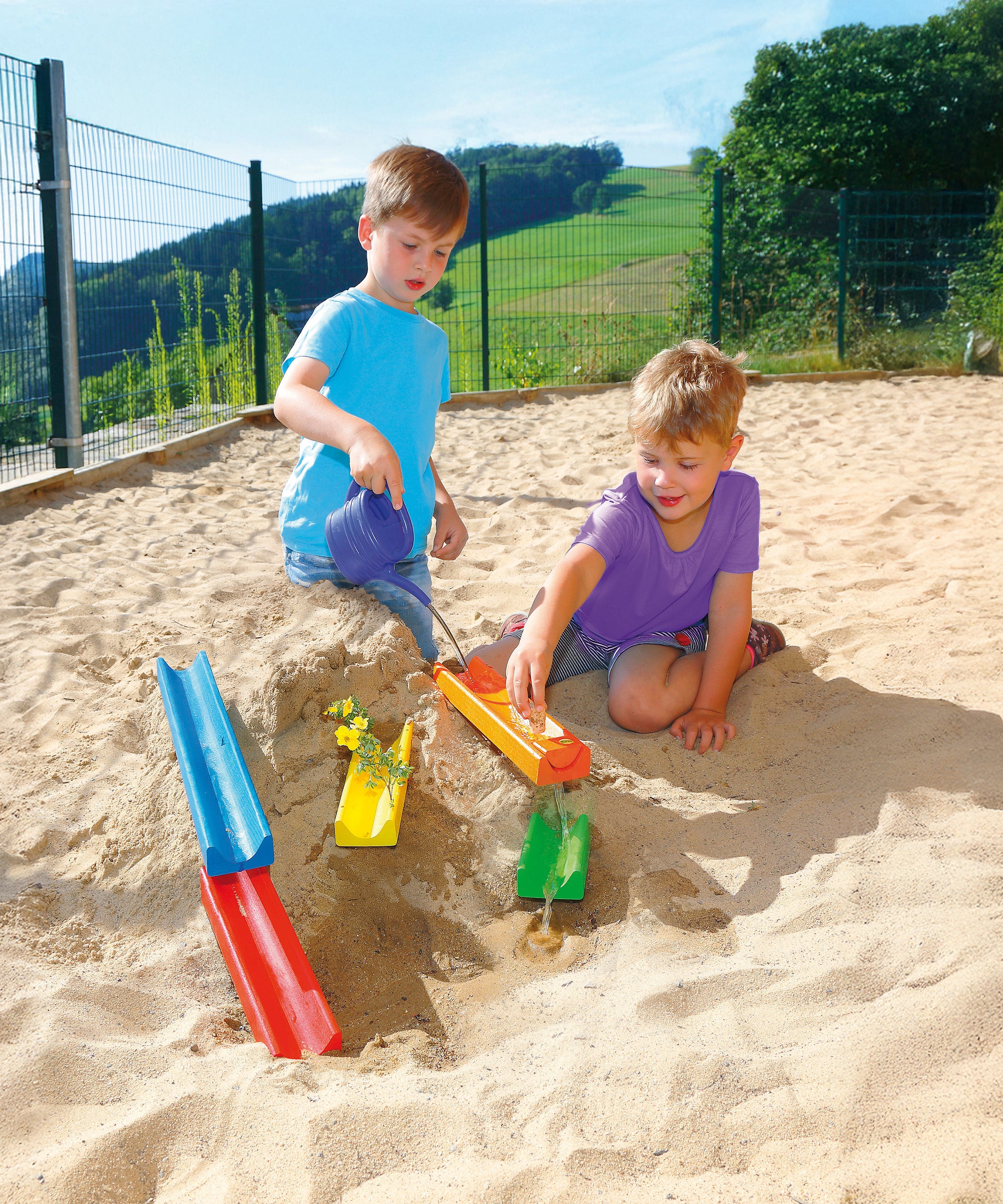 Erzi wooden water and marble run played with in the sand