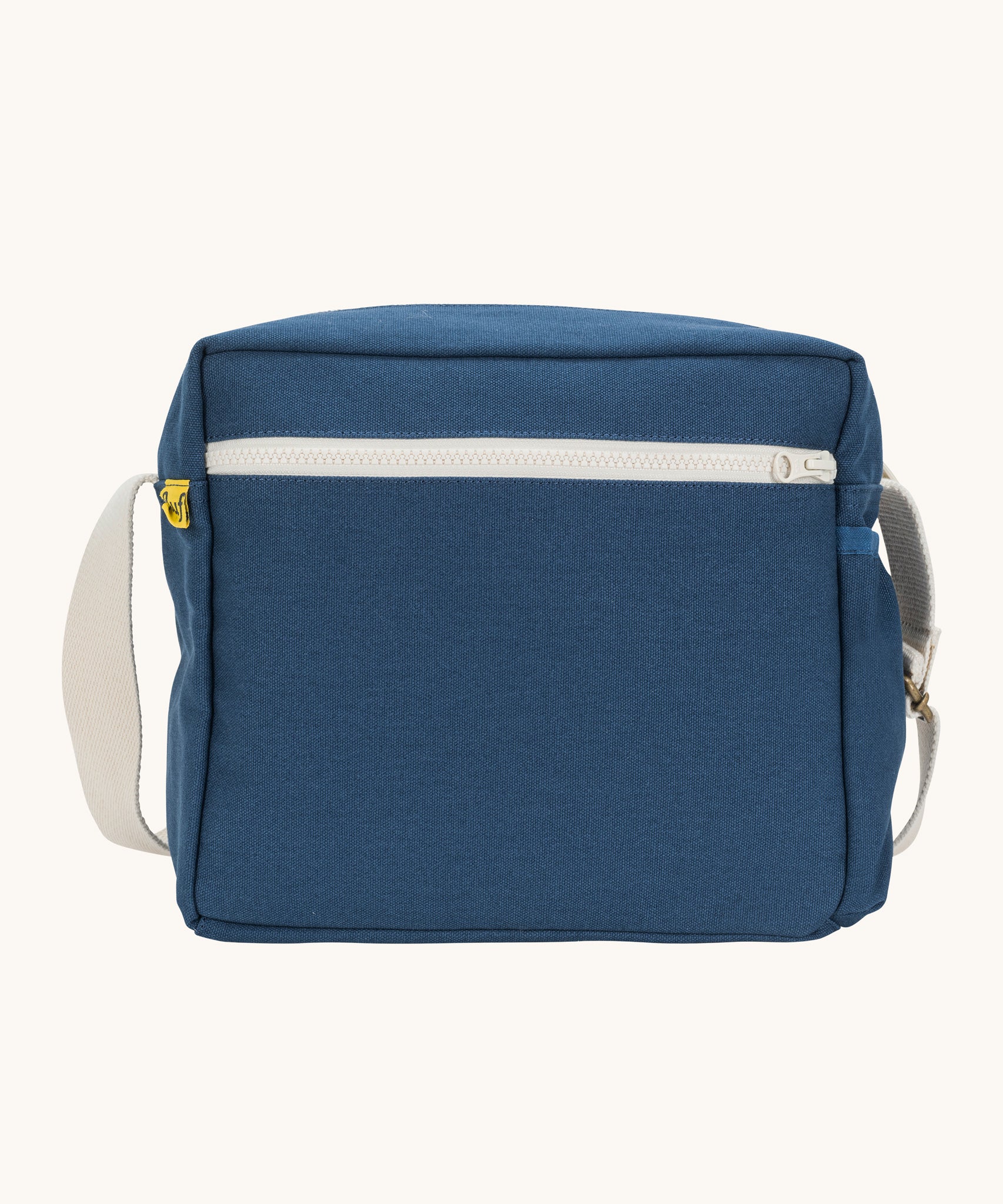 The classic navy coloured Fluf Crossbody Bag. The bag has and off white coloured zip an crossbody strap.