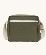 The dark olive green coloured Fluf Crossbody Bag. The bag has and off white coloured zip an crossbody strap.