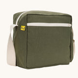 A side angle view of the dark olive green coloured Fluf Crossbody Bag. The bag has and off white coloured zip an crossbody strap.