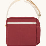 The classic vintage burgundy Fluf Crossbody Bag. The bag has and off white coloured zip an crossbody strap.