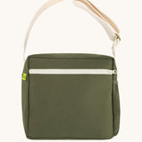 The dark olive green coloured Fluf Crossbody Bag. The bag has and off white coloured zip an crossbody strap.
