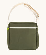 The dark olive green coloured Fluf Crossbody Bag. The bag has and off white coloured zip an crossbody strap.