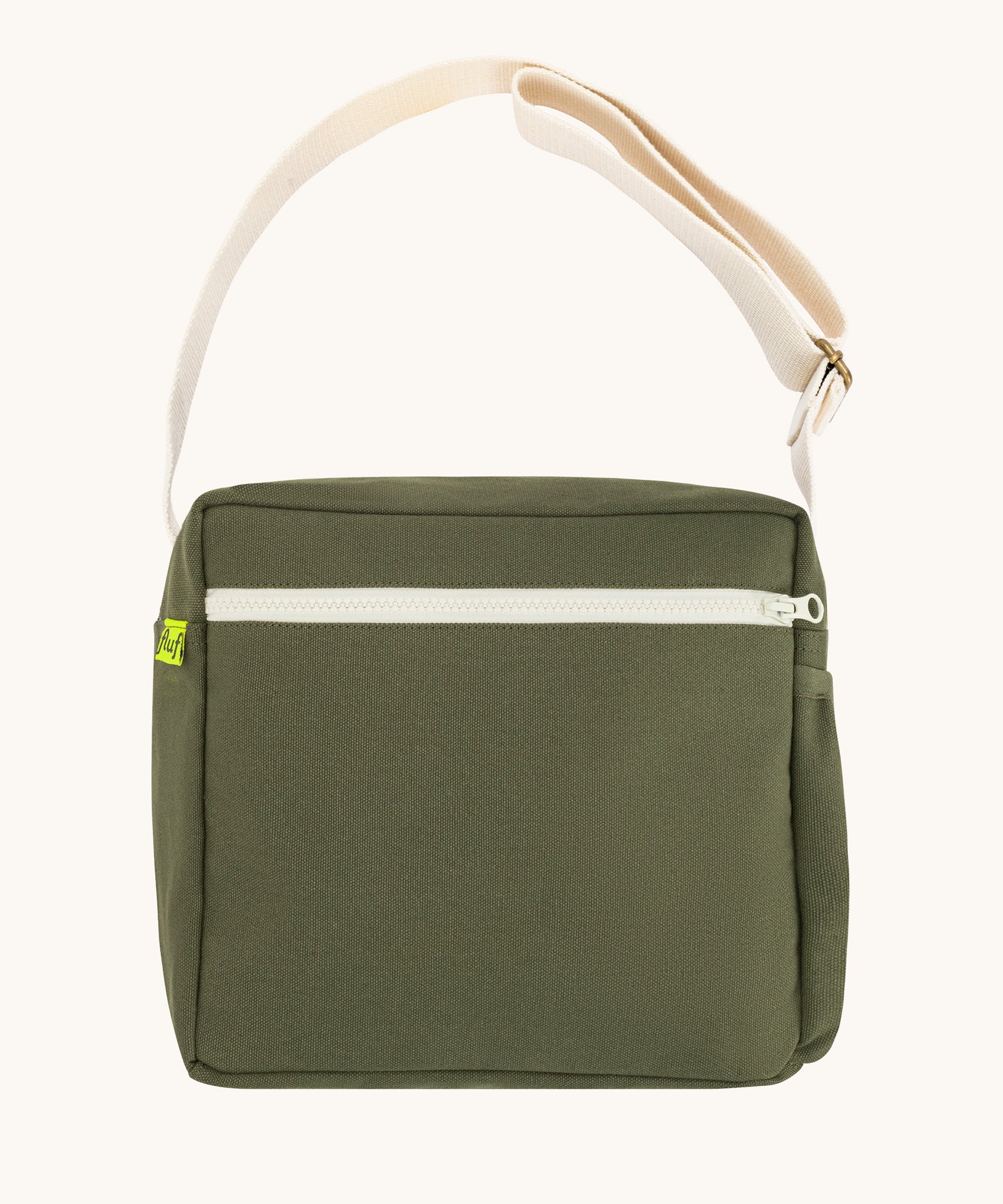 The dark olive green coloured Fluf Crossbody Bag. The bag has and off white coloured zip an crossbody strap.