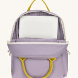 The organic cotton kids Fluf B-Pack Jr in lavender purple, the backpack is unzipped and there's a small laptop inside.