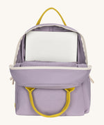 The organic cotton kids Fluf B-Pack Jr in lavender purple, the backpack is unzipped and there's a small laptop inside.
