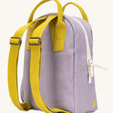 The back of the The organic cotton kids Fluf B-Pack Jr in lavender purple. The bag has yellow coloured straps.