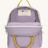 The organic cotton kids Fluf B-Pack Jr in lavender purple, the backpack is unzipped .