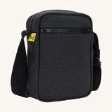 Sleek and compact Fluf Mini Crossbody Bag in black, organic cotton with recycled lining, machine washable, ideal for passports, keys and essentials on the go