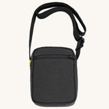 Black Fluf Mini Crossbody Bag made from GOTS certified organic cotton with recycled lining, sporty and stylish travel organiser with front zipper pocket and adjustable shoulder strap