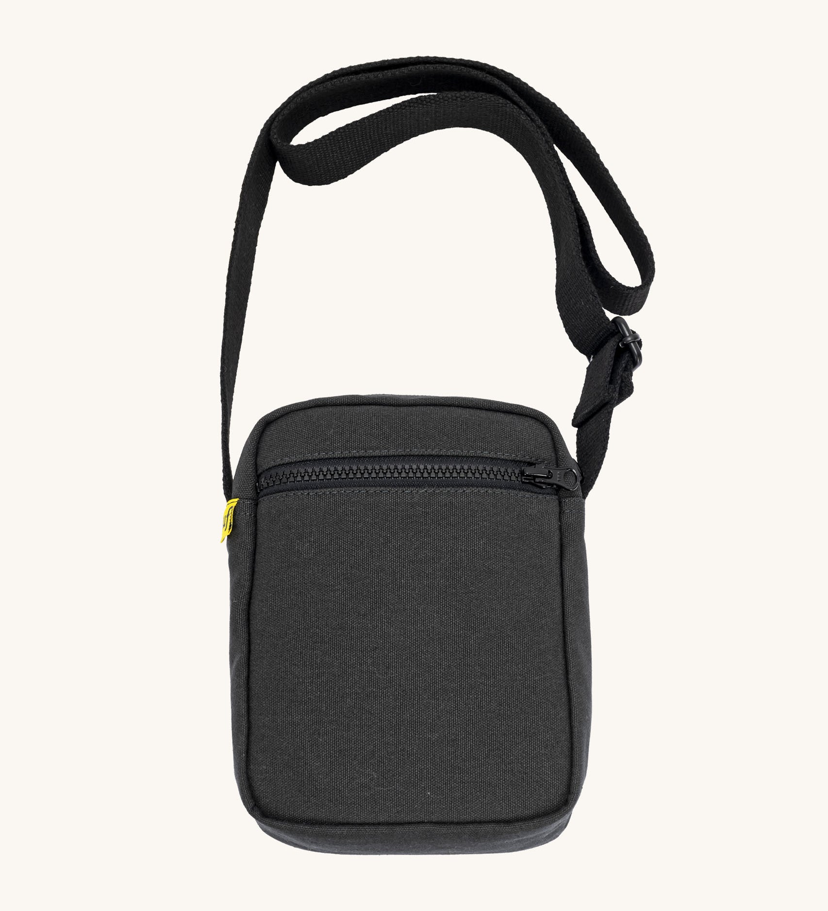 Black Fluf Mini Crossbody Bag made from GOTS certified organic cotton with recycled lining, sporty and stylish travel organiser with front zipper pocket and adjustable shoulder strap