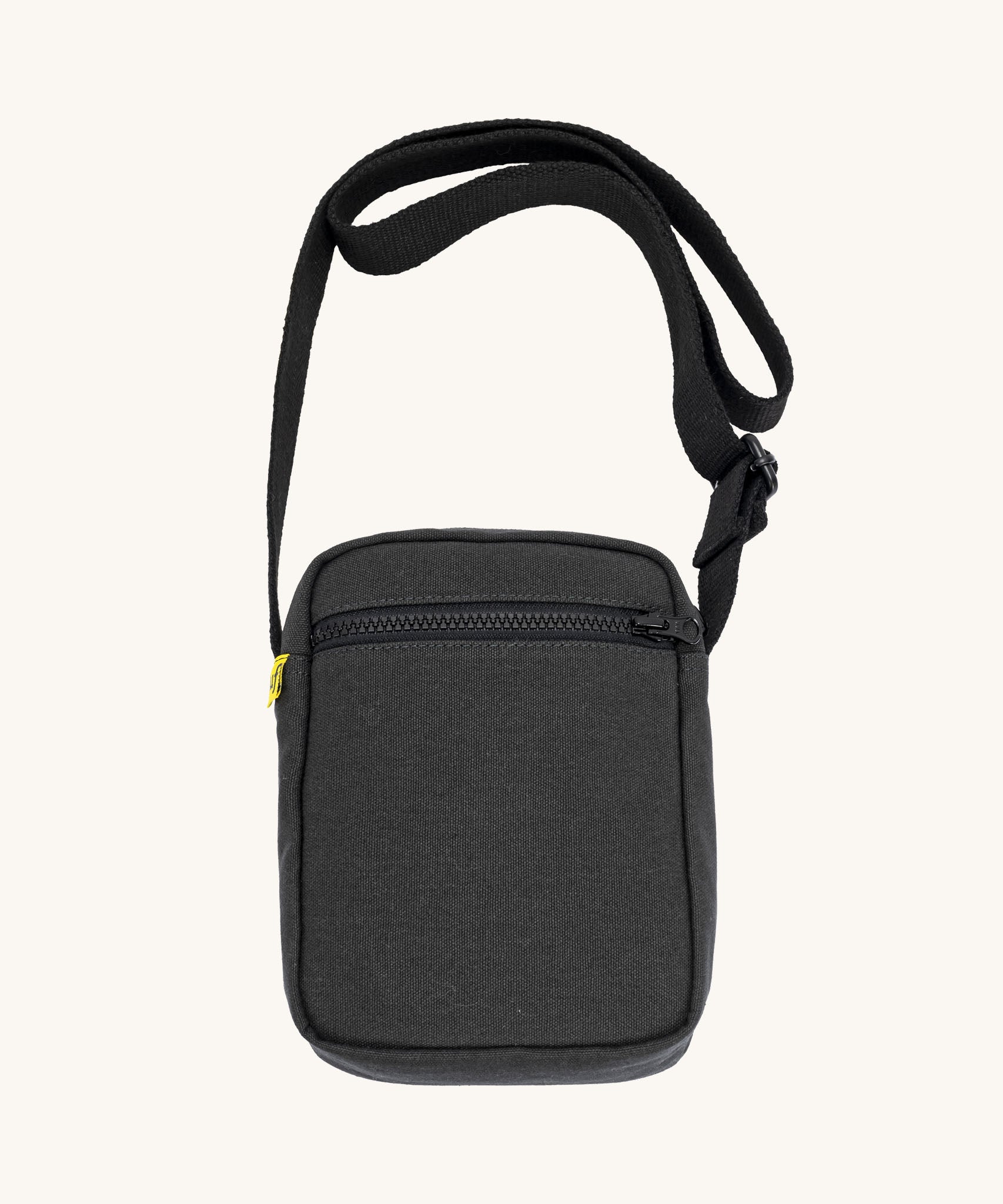 Black Fluf Mini Crossbody Bag made from GOTS certified organic cotton with recycled lining, sporty and stylish travel organiser with front zipper pocket and adjustable shoulder strap