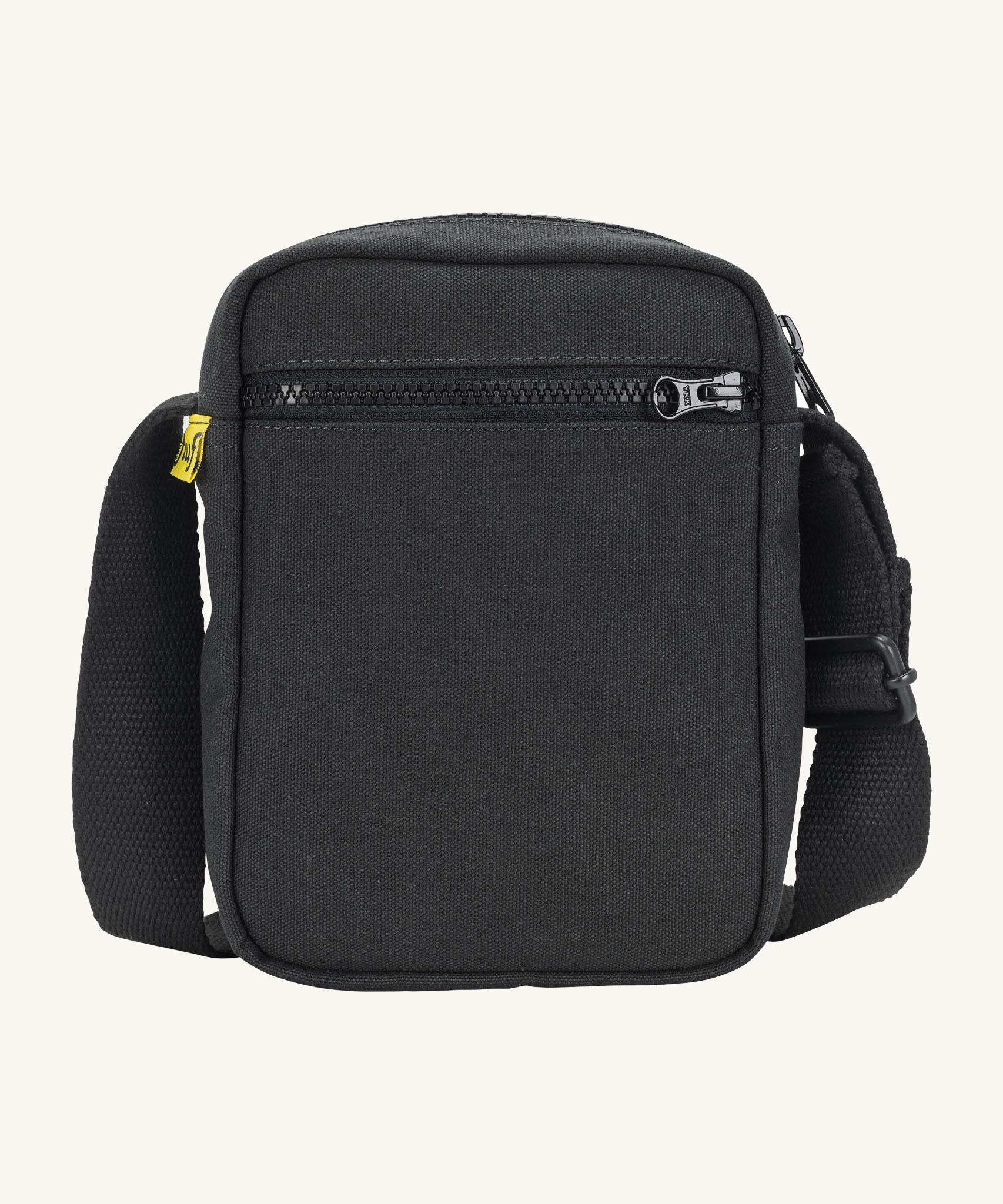 Sporty and functional Fluf Mini Crossbody Bag in black, GOTS organic cotton with adjustable strap, front zipper pocket, recycled interior, perfect for travel or everyday essentials
