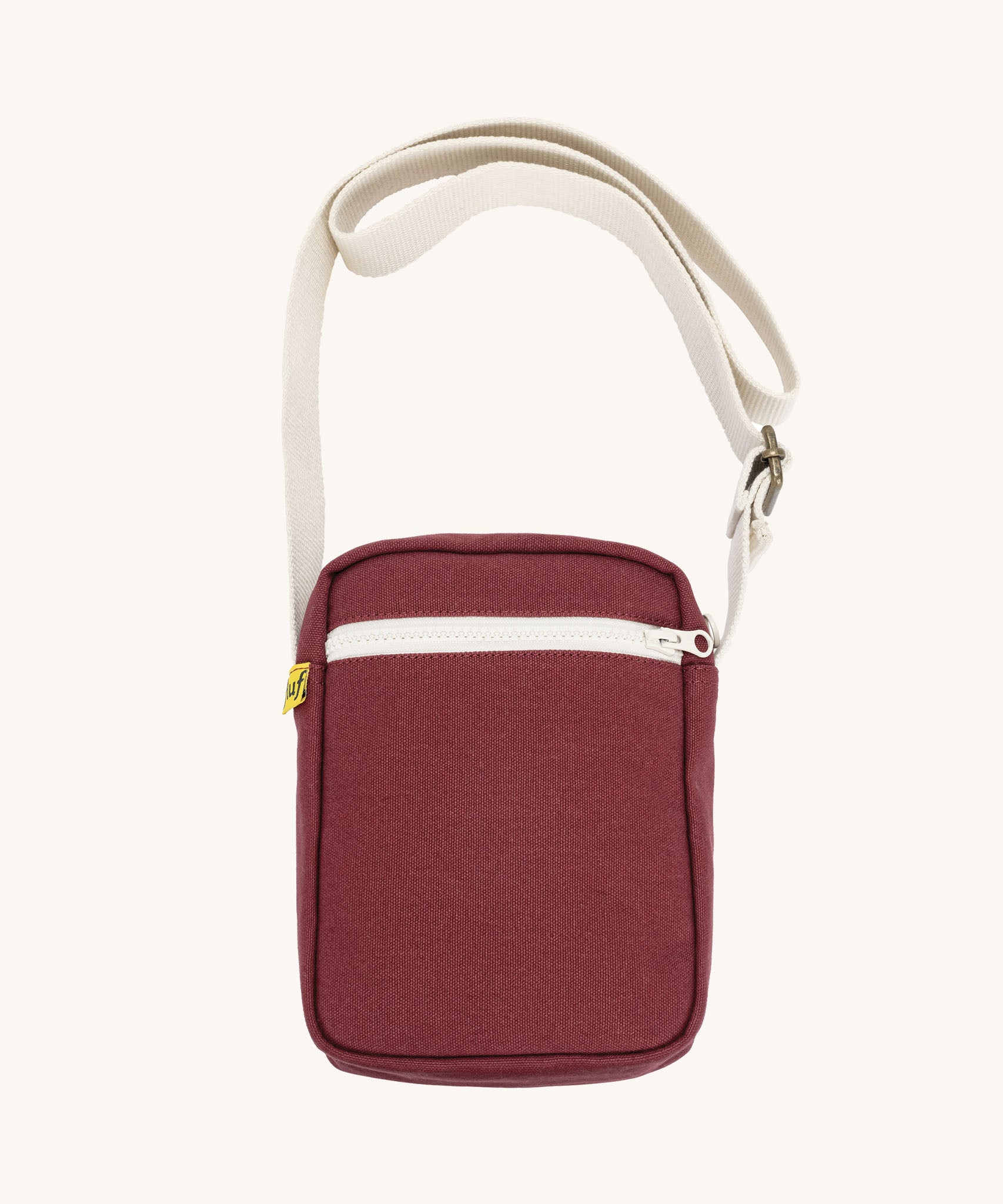Burgundy Fluf Mini Crossbody Bag made from GOTS certified organic cotton with recycled lining, sporty and stylish travel organiser with front zipper pocket and adjustable shoulder strap