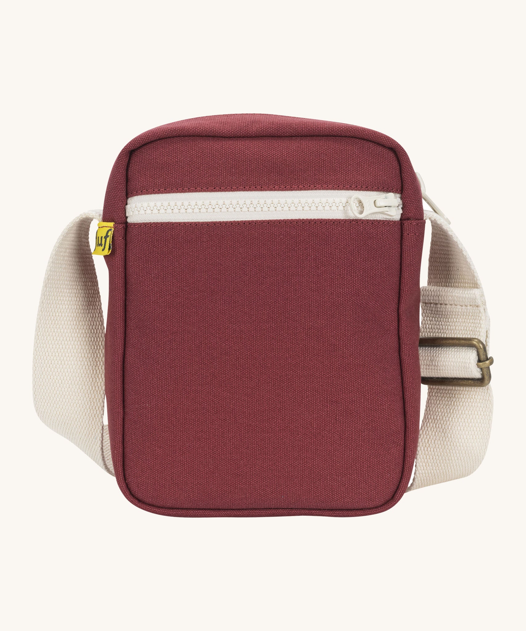 Sporty and functional Fluf Mini Crossbody Bag in burgundy, GOTS organic cotton with adjustable strap, front zipper pocket, recycled interior, perfect for travel or everyday essentials