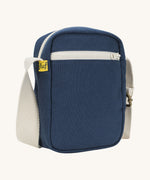 Sleek and compact Fluf Mini Crossbody Bag in navy blue, organic cotton with recycled lining, machine washable, ideal for passports, keys and essentials on the go