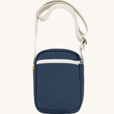 Navy blue Fluf Mini Crossbody Bag made from GOTS certified organic cotton with recycled lining, sporty and stylish travel organiser with front zipper pocket and adjustable shoulder strap
