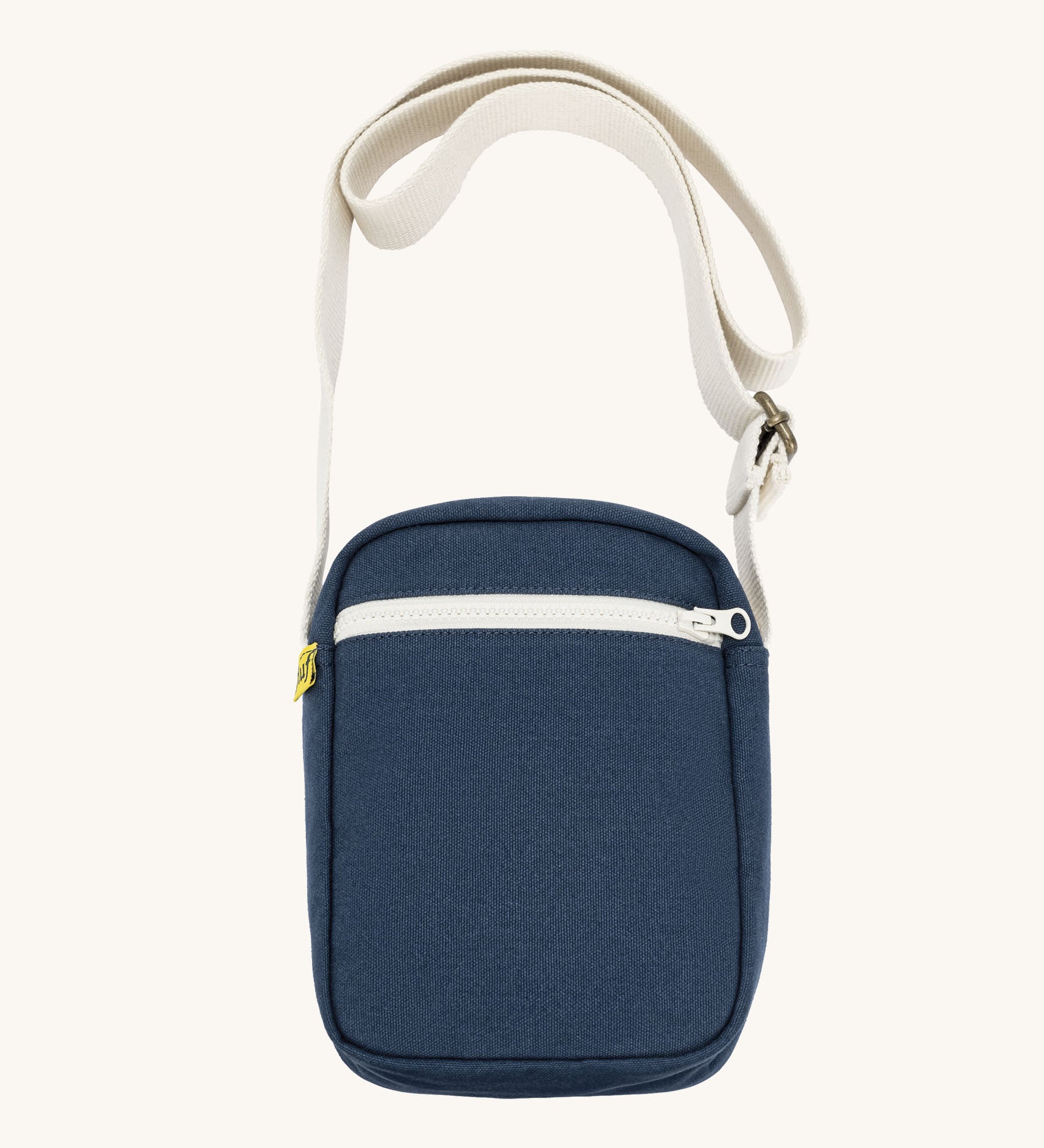 Navy blue Fluf Mini Crossbody Bag made from GOTS certified organic cotton with recycled lining, sporty and stylish travel organiser with front zipper pocket and adjustable shoulder strap