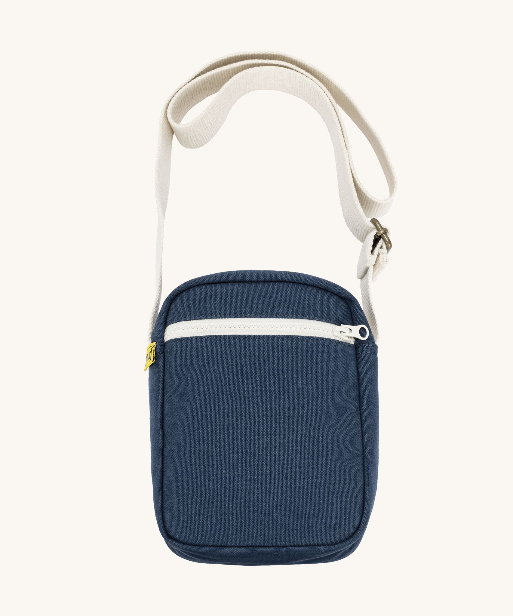 Navy blue Fluf Mini Crossbody Bag made from GOTS certified organic cotton with recycled lining, sporty and stylish travel organiser with front zipper pocket and adjustable shoulder strap