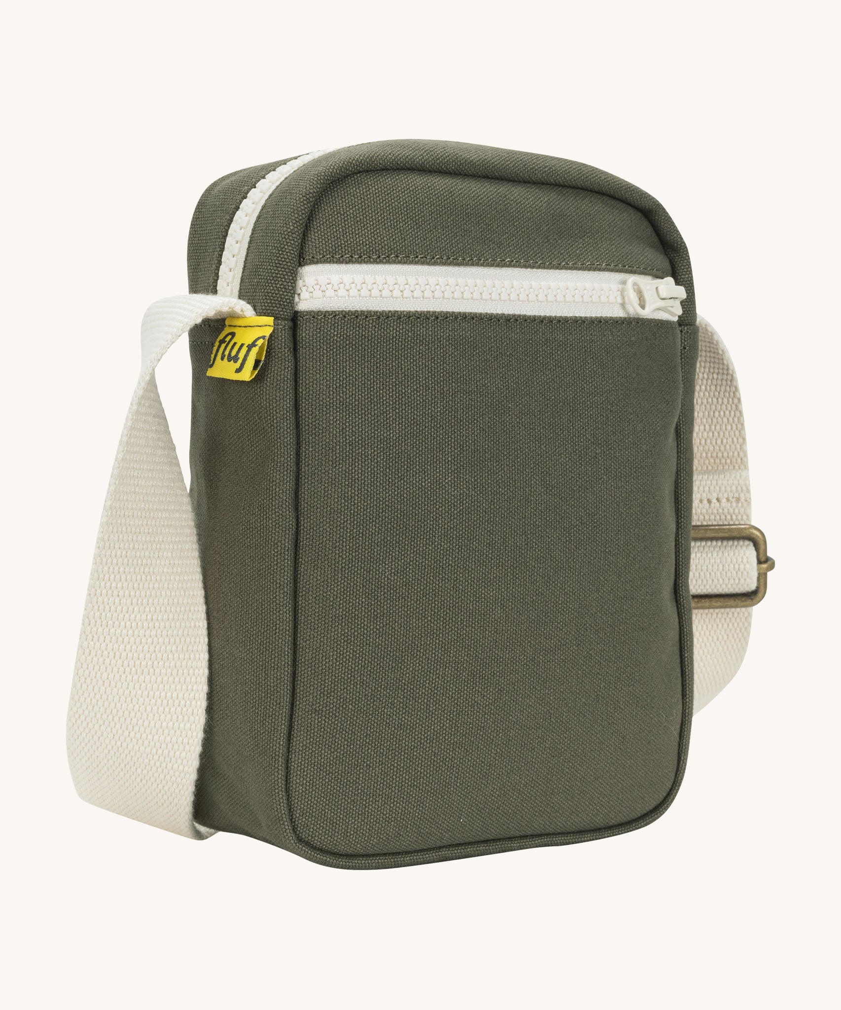 Sleek and compact Fluf Mini Crossbody Bag in olive green, organic cotton with recycled lining, machine washable, ideal for passports, keys and essentials on the go