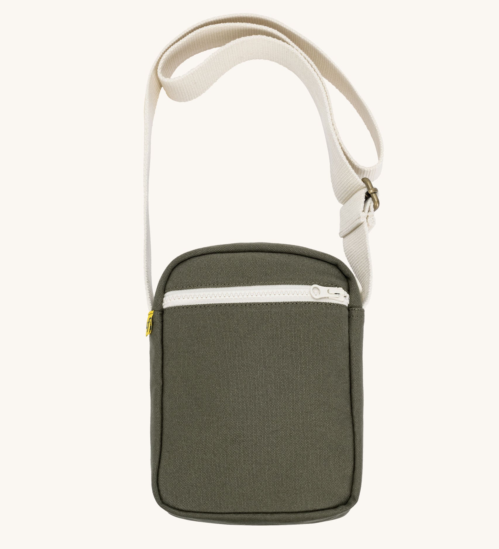 Olive green Fluf Mini Crossbody Bag made from GOTS certified organic cotton with recycled lining, sporty and stylish travel organiser with front zipper pocket and adjustable shoulder strap