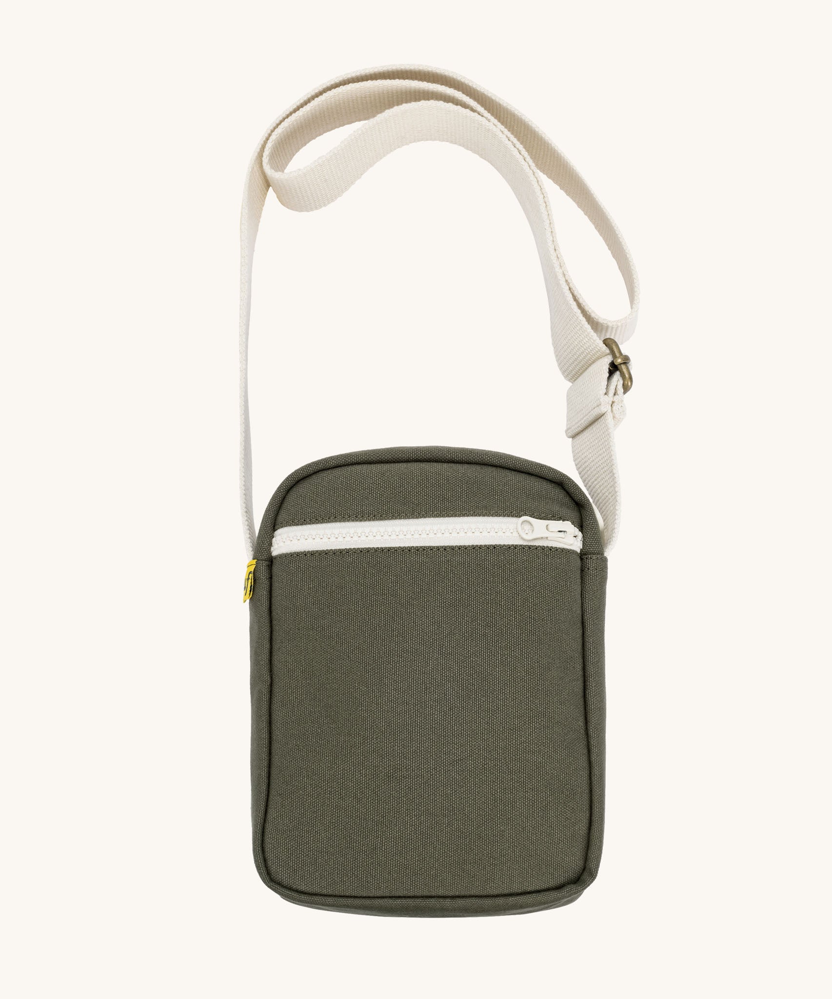 Olive green Fluf Mini Crossbody Bag made from GOTS certified organic cotton with recycled lining, sporty and stylish travel organiser with front zipper pocket and adjustable shoulder strap