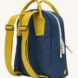 A view of the back of the organic cotton kids Fluf B-Pack Jr in navy blue, the backpacks yellow straps.