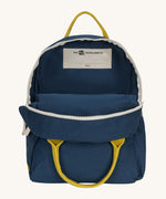 The organic cotton kids Fluf B-Pack Jr in navy blue, the backpack is unzipped.