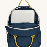 The organic cotton kids Fluf B-Pack Jr in navy blue, the backpack is unzipped and there's a small laptop inside.
